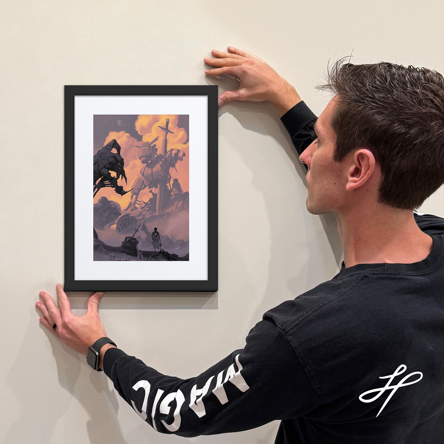 Jake Hartigan Holding a framed limited edition print of "Bravery" from the collection Conquer Fear