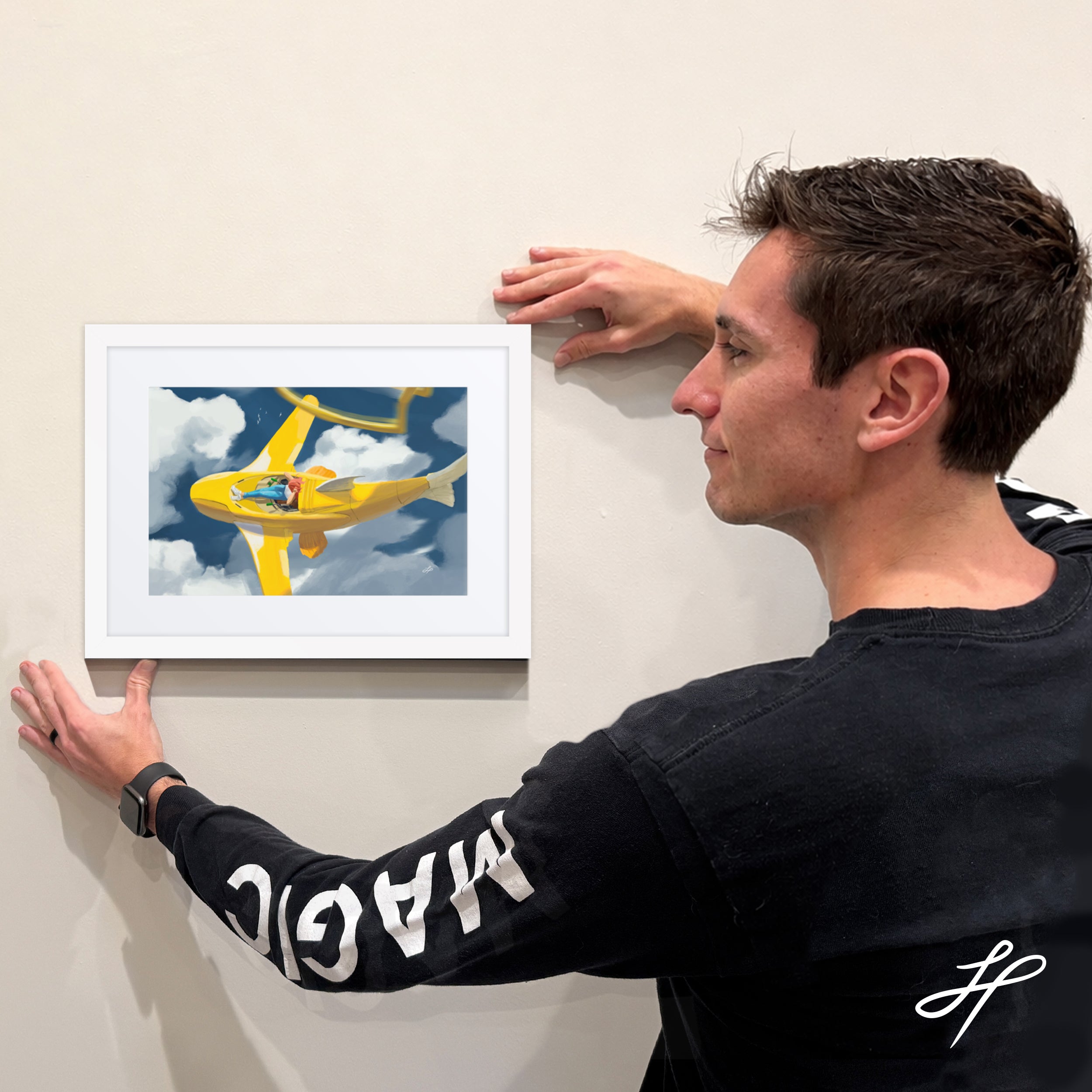 Jake Hartigan holding a limited edition framed print of "Relief" from the collection Conquer Fear