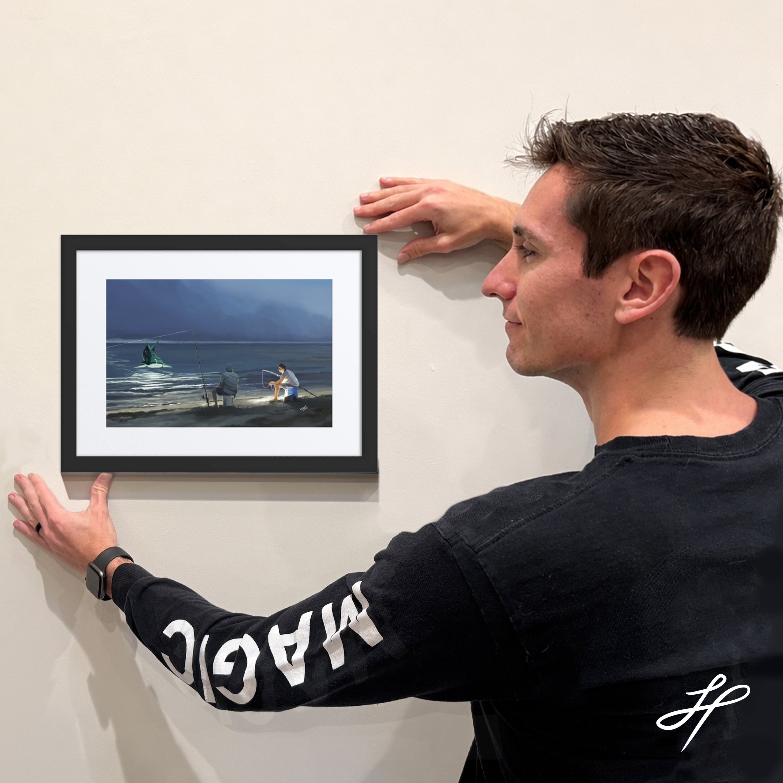 Jake Hartigan holding a framed limited edition print of "Surprise"
